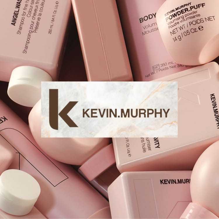 Logo of Kevin Murphy on a backdrop of pastel pink hair product bottles.